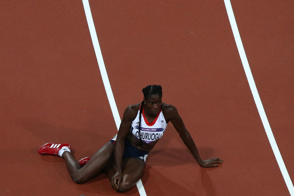 Christine Ohuruogu of Great Britain lays on the ground after winning the silver medal in the Women's 400m Final on Day 9 of the London 2012 Olympic Games at the Olympic Stadium on August 5, 2012 in London, England. (Photo by Richard Heathcote/Getty Images)