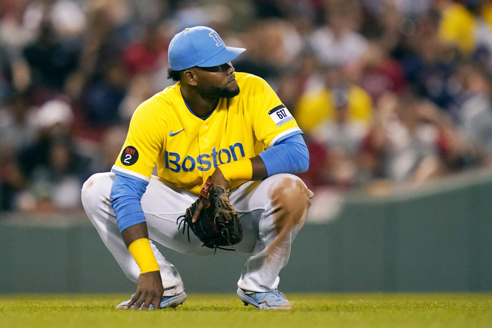 Boston Red Sox first baseman Franchy Cordero reacts after committing a throwing error, his third error of the night, during the eighth inning of the team's baseball game against the Cleveland Guardians at Fenway Park, Wednesday, July 27, 2022, in Boston. (AP Photo/Charles Krupa)