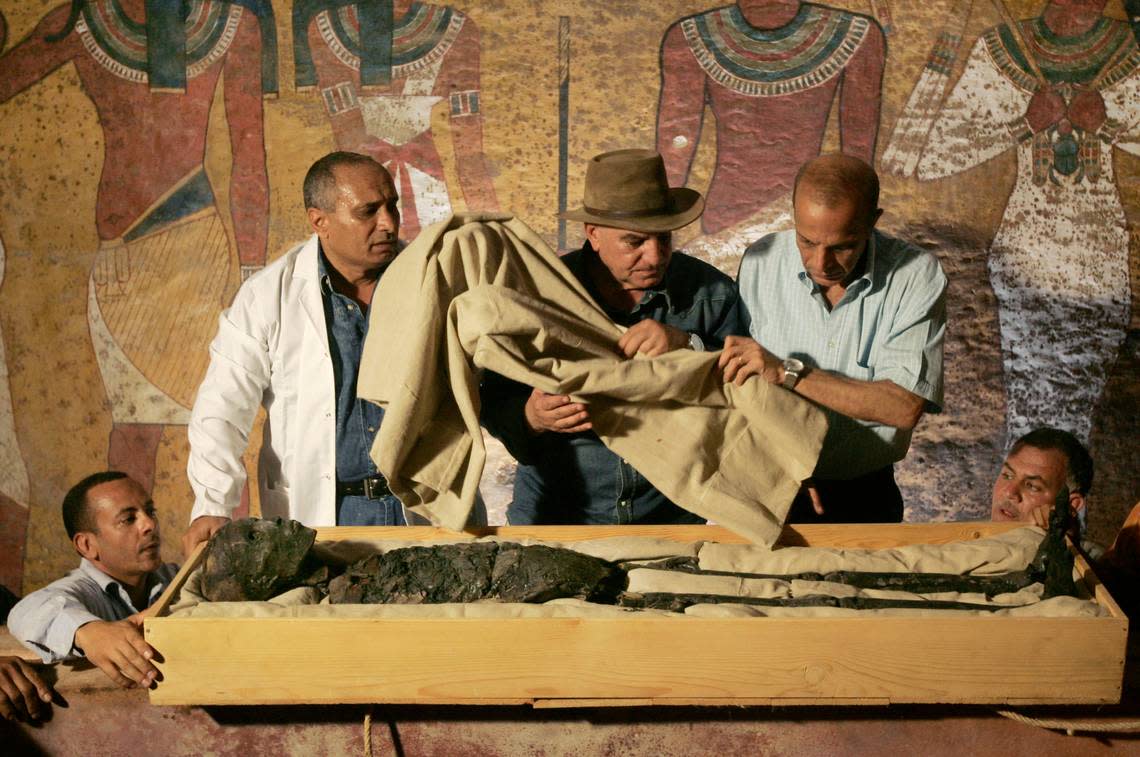 Egypt’s antiquities chief supervises the 2007 removal of the mummy of King Tutankhamun from his stone sarcophagus in his underground tomb in the famed Valley of the Kings in Luxor, Egypt.