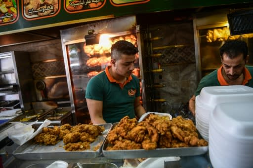 Syrian men work in a restaurant in the Turkish city of Gaziantep, home to around half a million Syrians who fled the civil war south of the border