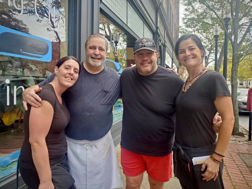 Kevin James, middle, with co-owner Doug Sterling, left, and two servers from The Whaling City Diner.