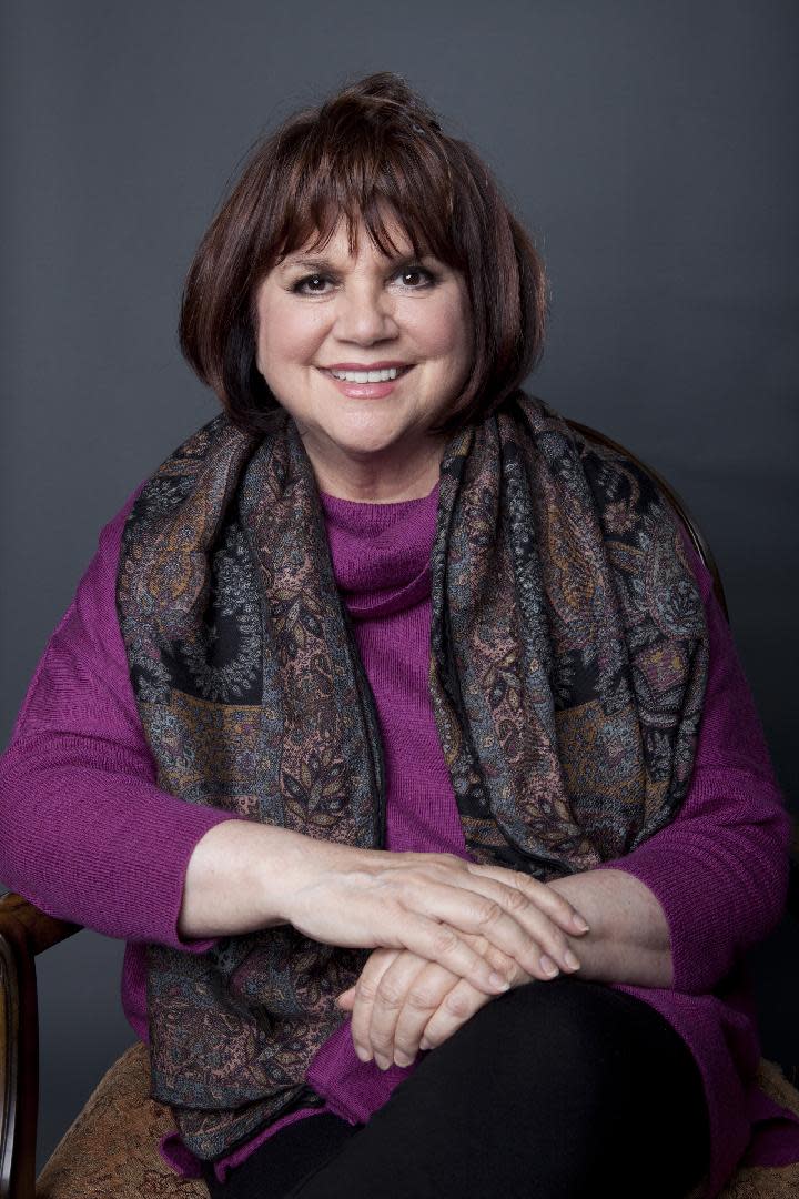 This Sept. 17, 2013 photo shows American musician Linda Ronstadt poses in New York to promote the release of her memoir "Simple Dreams." (Photo by Amy Sussman/Invision/AP)