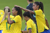 Brazil midfielder Adriana, left, is congratulated by Rafaelle, right, after Adriana scored a goal during the second half of a SheBelieves Cup women's soccer match, Thursday, Feb. 18, 2021, in Orlando, Fla. (AP Photo/Phelan M. Ebenhack)