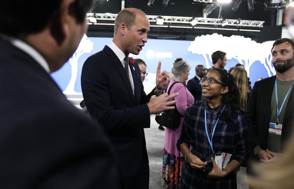 Britain's Prince William, second left, speaks with Earthshot finalist Vinisha Umashankar, second right, during a meeting with Earthshot prize winners, finalists and heads of state on the sidelines of the COP26 U.N. Climate Summit in Glasgow, Scotland, Tuesday, Nov. 2, 2021. The U.N. climate summit in Glasgow gathers leaders from around the world, in Scotland's biggest city, to lay out their vision for addressing the common challenge of global warming. (AP Photo/Alastair Grant, Pool)