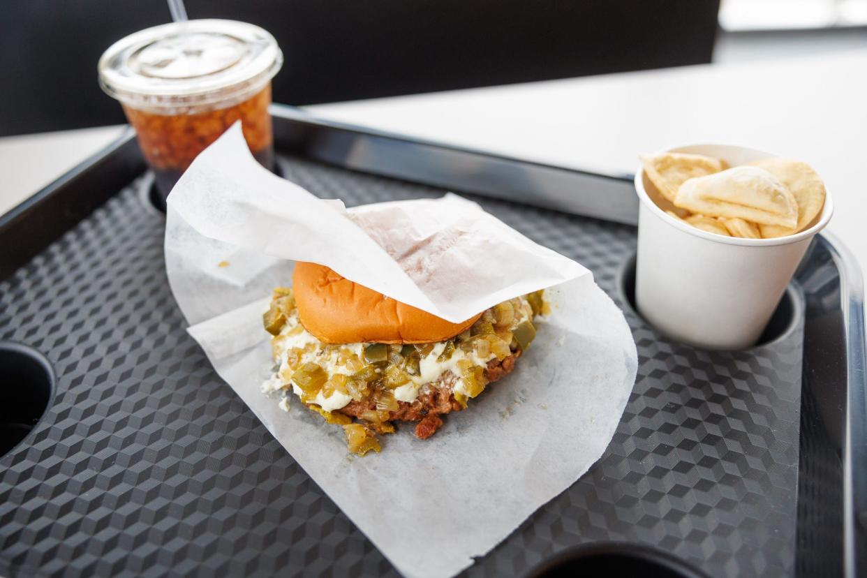 A Jalapeño popper Beyond burger, with a side of pierogies, is seen during the grand opening of Greer's Burger Garage, Thursday, March 28, 2024, in downtown Hanover.