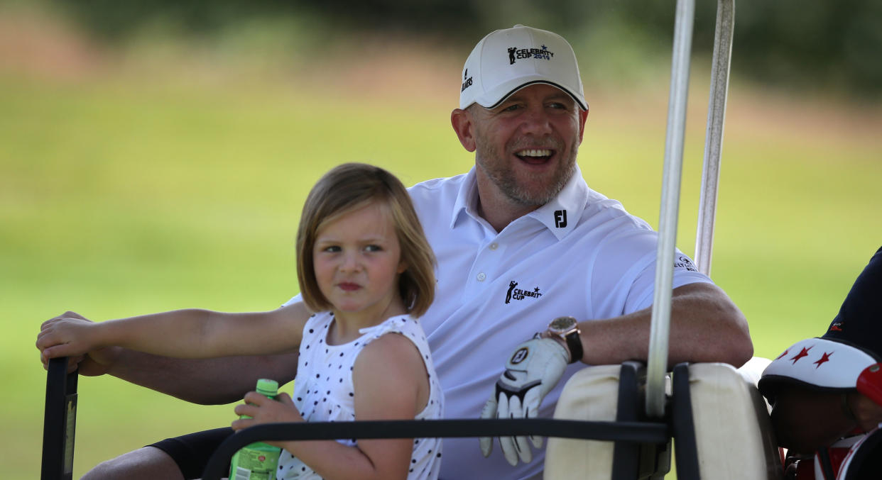 Mike Tindall rides on a golf cart with his daughter Mia during the Celebrity Cup charity fundraiser golf tournament at the Celtic Manor Resort in Newport, Gwent. (Photo by Andrew Matthews/PA Images via Getty Images)