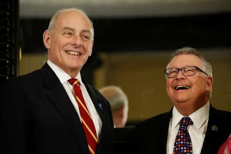 U.S. Homeland Security Secretary John Kelly (L) takes part in a group photo with Canada's Public Safety Minister Ralph Goodale on Parliament Hill in Ottawa, Ontario, Canada, March 10, 2017. REUTERS/Chris Wattie