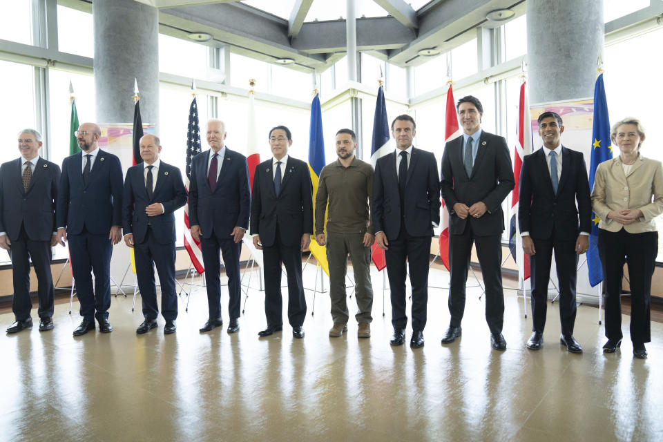 Ukrainian President Volodymyr Zelenskyy, center, poses with G7 world leaders on the final day of the G7 Summit in Hiroshima, Japan, Sunday, May 21, 2023. From left to right are: Gianluigi Benedetti, Italian ambassador to Japan, European Council President Charles Michel, German Chancellor Olaf Scholz, U.S. President Joe Biden, Japan's Prime Minister Fumio Kishida, Zelenskyy, France's President Emmanuel Macron, Canada's Prime Minister Justin Trudeau, Britain's Prime Minister Rishi Sunak and European Commission President Ursula von der Leyen (Stefan Rousseau/Pool via AP)