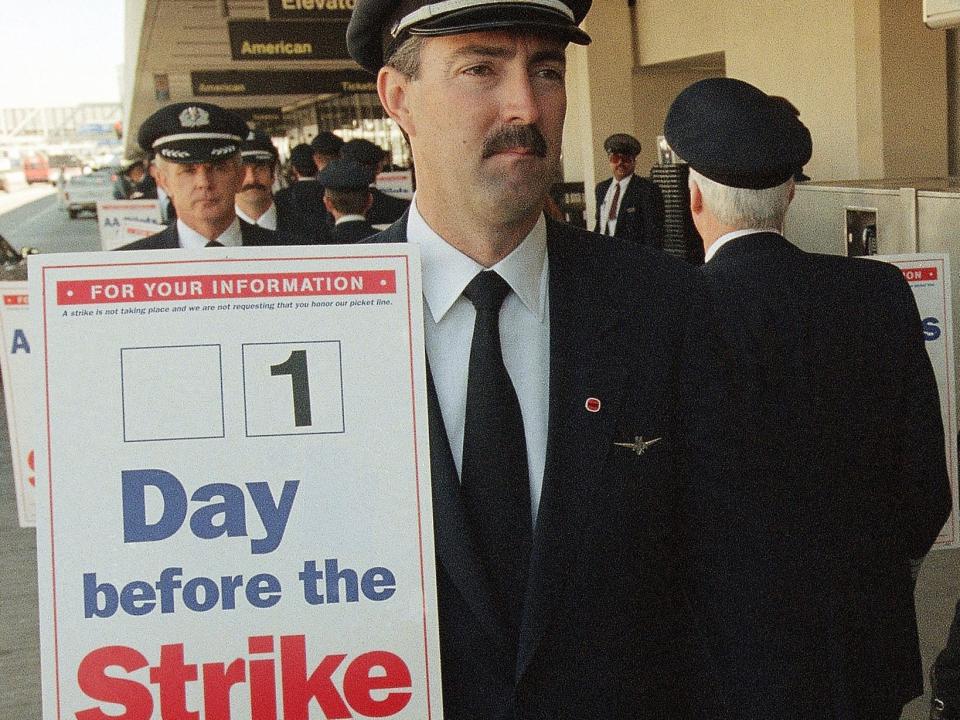 American Airlines pilot Gary Keene walks a picket line with other pilots at Los Angeles International Airport on February 14, 1997.