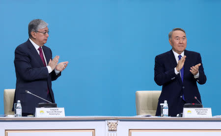 Kazakhstan's President Kassym-Jomart Tokayev and former President Nursultan Nazarbayev attend a congress of the Nur Otan ruling party in Nur-Sultan, Kazakhstan, April 23, 2019. REUTERS/Mukhtar Kholdorbekov