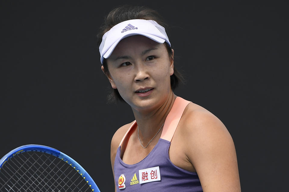 FILE - China's Peng Shuai reacts during her first round singles match against Japan's Nao Hibino at the Australian Open tennis championship in Melbourne, Australia, Jan. 21, 2020. The women’s professional tennis tour is ending its suspension of tournaments in China that was initiated in late 2021 over concerns about Grand Slam doubles champion Peng Shuai’s well-being. The WTA announced Thursday, April 13, 2023, that it will return to competition in China this season, even though two of its key requests were never met: a chance to meet with Peng, and a thorough, transparent investigation of her sexual assault accusations against a high-ranking Chinese government official.(AP Photo/Andy Brownbill, File)