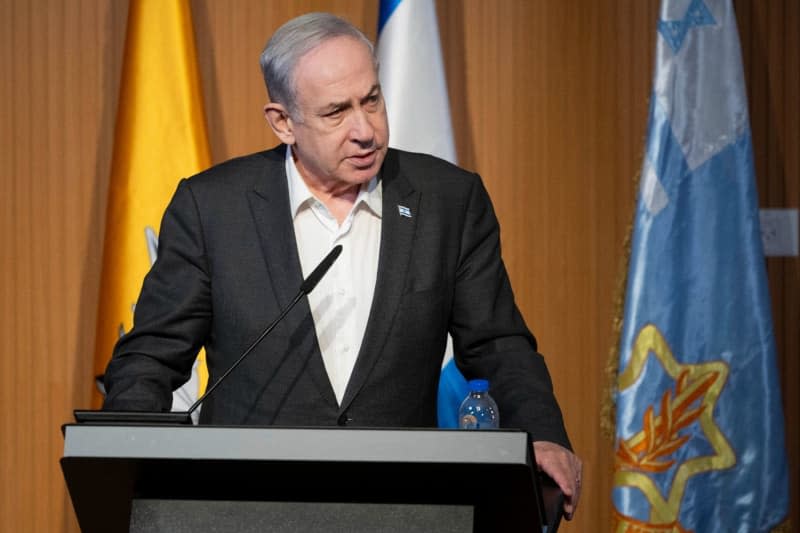 Israeli Prime Minister Benjamin Netanyahu speaks during a visit to the base of the IDF Yahalom Unit Amos Ben-Gershom/GPO/dpa