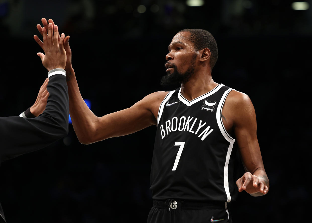 NEW YORK, NEW YORK - JANUARY 15:  Kevin Durant #7 of the Brooklyn Nets celebrates a basket against the New Orleans Pelicans during their NBA game at Barclays Center on January 15, 2022 in New York City.  NOTE TO USER: User expressly acknowledges and agrees that, by downloading and or using this photograph, User is consenting to the terms and conditions of the Getty Images License Agreement. (Photo by Al Bello/Getty Images)