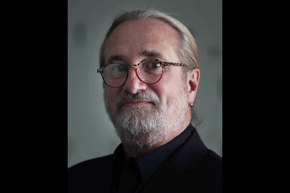 Fernando Gonzalez poses for a portrait in Mexico City, March 23, 2020. Gonzalez, 60, who spent decades covering and directing major stories for The Associated Press across Latin America, died in Havana, Cuba late Sunday, Nov. 21, 2021 when he fell suddenly ill at his home. (AP Photo/Marco Ugarte)