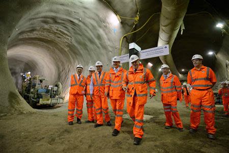 Britain's Prime Minister David Cameron (4th L) and London Mayor Boris Johnson (3rd R) visit a Crossrail construction site beneath Tottenham Court Road in central London January 16, 2014. REUTERS/Ben Stansall/pool