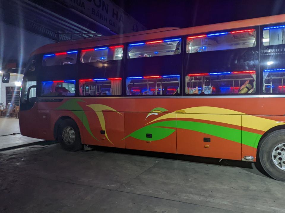 External shot of 24 hour sleeper bus in Hanoi, Vietnam.