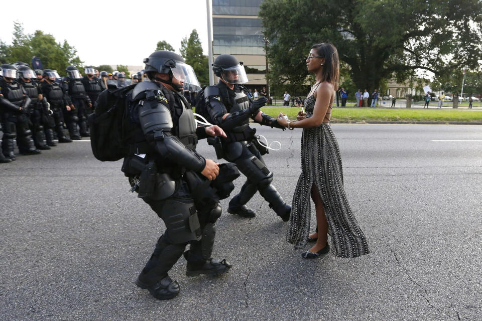 Lone activist Ieshia Evans stands her ground while offering her hands for arrest as she is charged by riot police during a July 2016 protest against police brutality in Baton Rouge, Louisiana. Evans, a 28-year-old Pennsylvania nurse, traveled to Baton Rouge to protest the death of Alton Sterling, a Black father who was shot at close range by two white police officers. (Photo: Jonathan Bachman / Reuters)