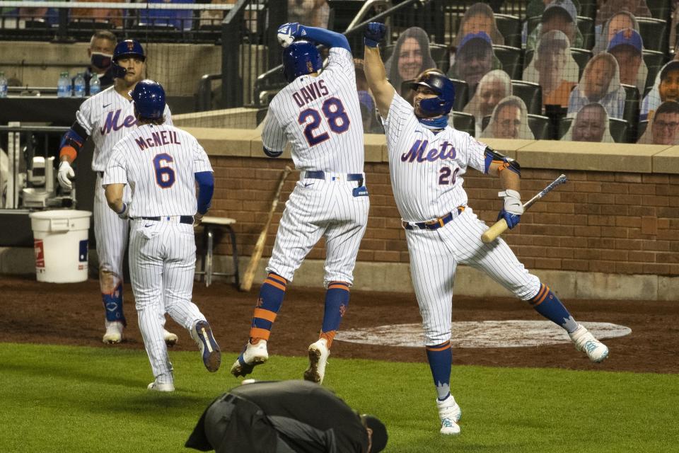 New York Mets' J.D. Davis (28) celebrates with teammate Pete Alonso (20) after hitting a three-run home run during the seventh inning of a baseball game against the Miami Marlins Saturday, Aug. 8, 2020, in New York. (AP Photo/Frank Franklin II)