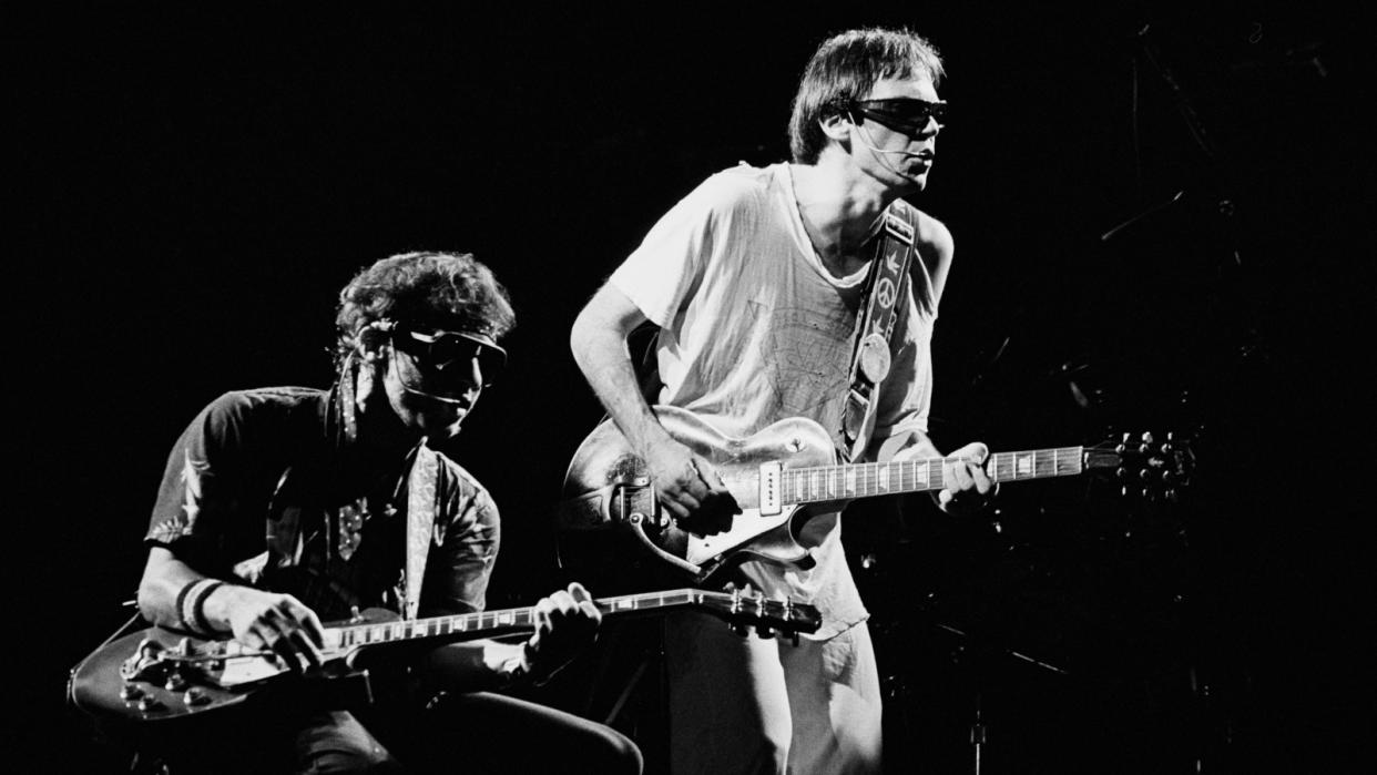  Neil Young (right) and Nils Lofgren onstage in Paris, September 16, 1982, shortly before making the album Trans. 