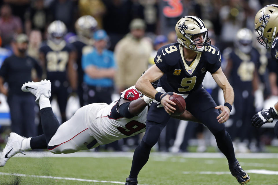 New Orleans Saints quarterback Drew Brees (9) is sacked by Atlanta Falcons defensive tackle Grady Jarrett (97) in the second half of an NFL football game in New Orleans, Sunday, Nov. 10, 2019. (AP Photo/Rusty Costanza)