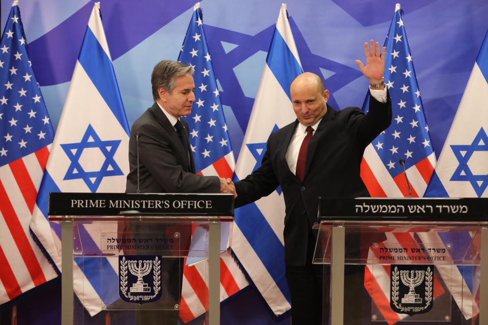 Israeli Prime Minister Naftali Bennett, right, and U.S. Secretary of State Antony Blinken shake hands during a press statement after their meeting at the prime minister's office in Jerusalem, Sunday, March 27, 2022. (Abir Sultan/Pool via AP)