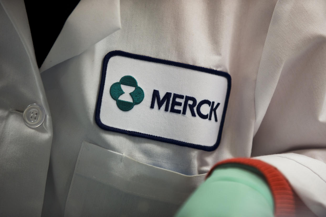 FILE - In this Thursday, Feb. 28, 2013 file photo, a Merck logo is placed on scientist's lab coat in West Point, Pa. The Food and Drug Administration on Thursday, Sept. 4, 2014 said it has granted accelerated approval to Merck's Keytruda, for treating melanoma that's spread or can't be surgically removed, in patients previously treated with another drug. (AP Photo/Matt Rourke, File)