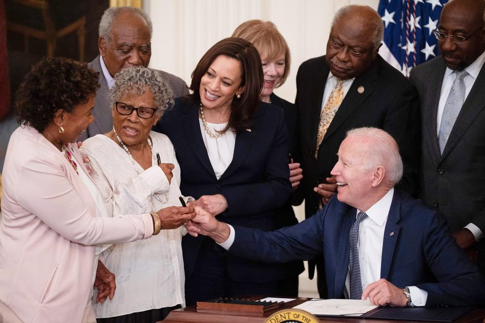 Ninety-four-year-old activist and retired educator Opal Lee, known as the Grandmother of Juneteenth, speaks with U.S. President Joe Biden after he signed the Juneteenth National Independence Day Act into law in the East Room of the White House on June 17, 2021 in Washington, DC