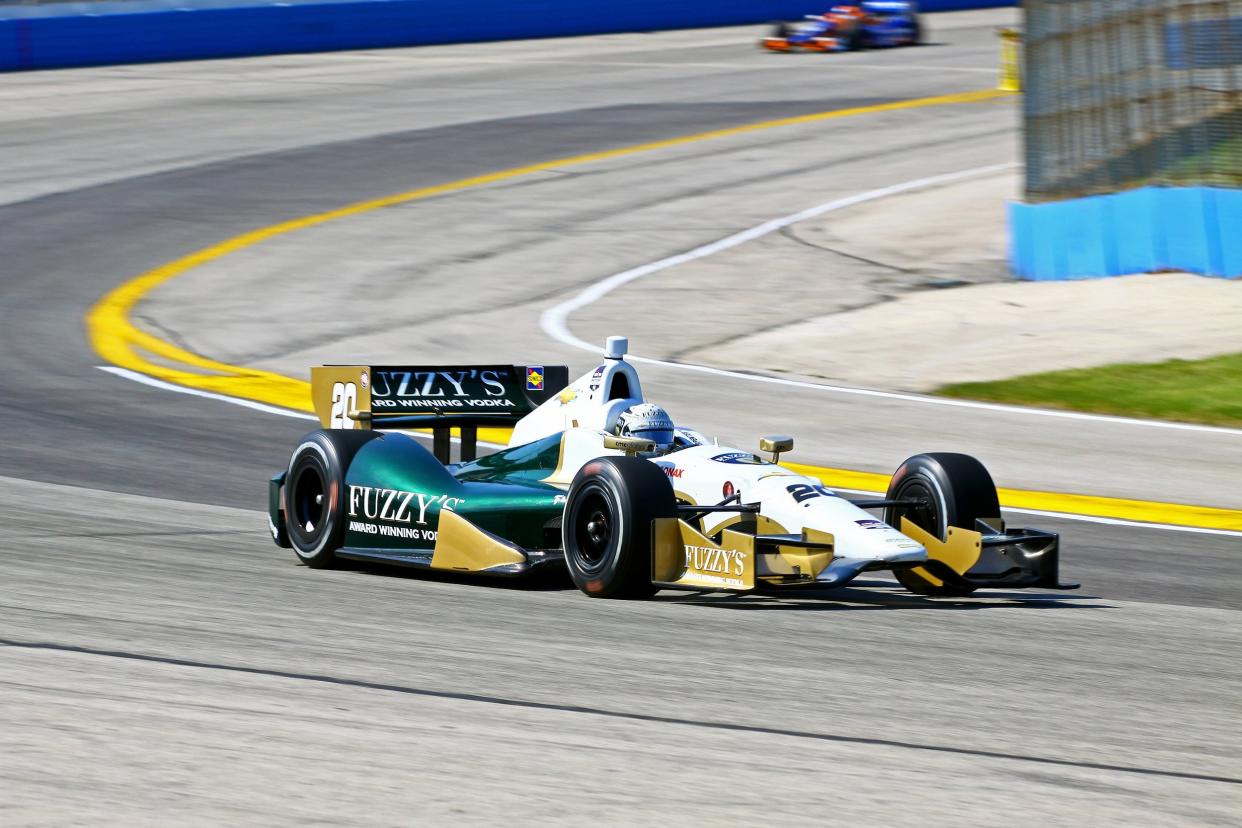 open-wheel chassis IndyCar on the Indianapolis Motor Speedway