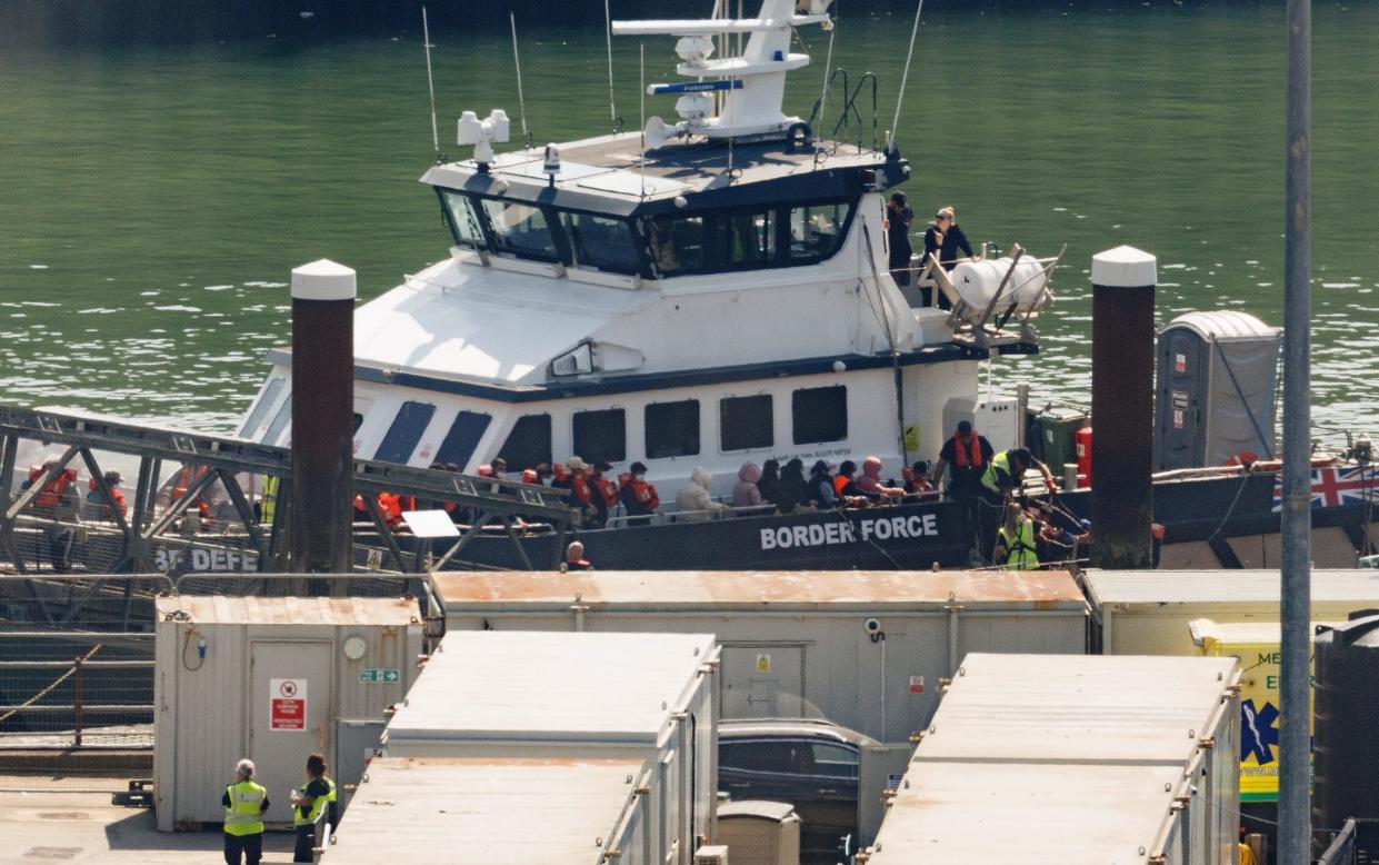 A Border Force vessel brings ashore a group of migrants, picked up in the Channel, in Kent on Monday