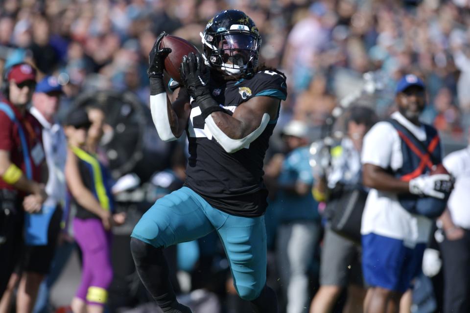 Jacksonville Jaguars running back JaMycal Hasty (22) makes a touchdown pass during second quarter action.  The Jacksonville Jaguars host the Baltimore Ravens at TIAA Bank Field in Jacksonville, FL on Sunday, November 27, 2022. [Bob Self/Florida Times-Union]