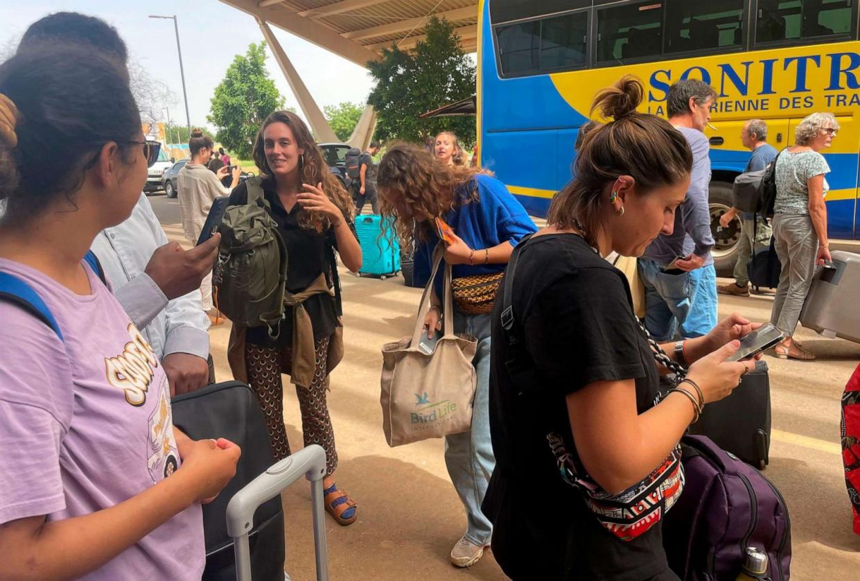 PHOTO: French nationals gather as they wait to be airlifted back to France on a French military aircraft, at the international airport in Niamey, Niger, Aug. 1, 2023. (Sam Mednick/AP)