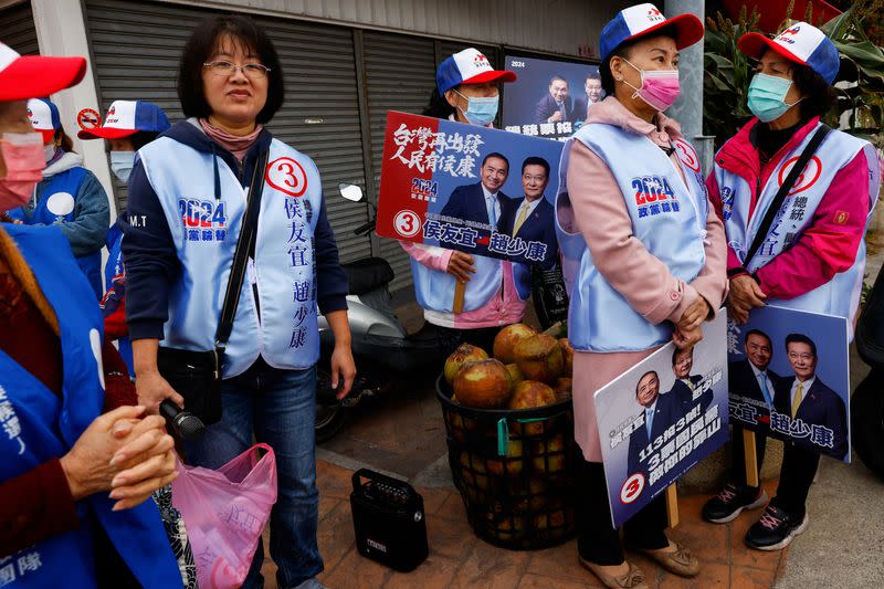 Supporters and volunteers of the main opposition party Kuomintang (KMT) wait for a campaign event in Kinmen
