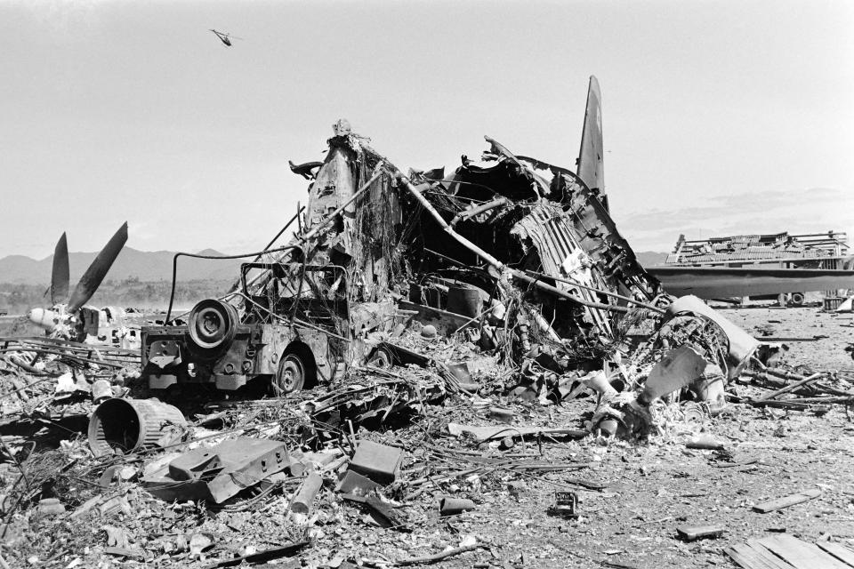 An American aircraft sits in rubble amid attacks by North Vietnamese forces after the battle of Dak To in 1967.