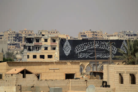 A banner belonging to IslamicStates fighters is seen during a battle with member of the Syrian Democratic Forces in Raqqa, Syria August 16, 2017. REUTERS/Zohra Bensemra