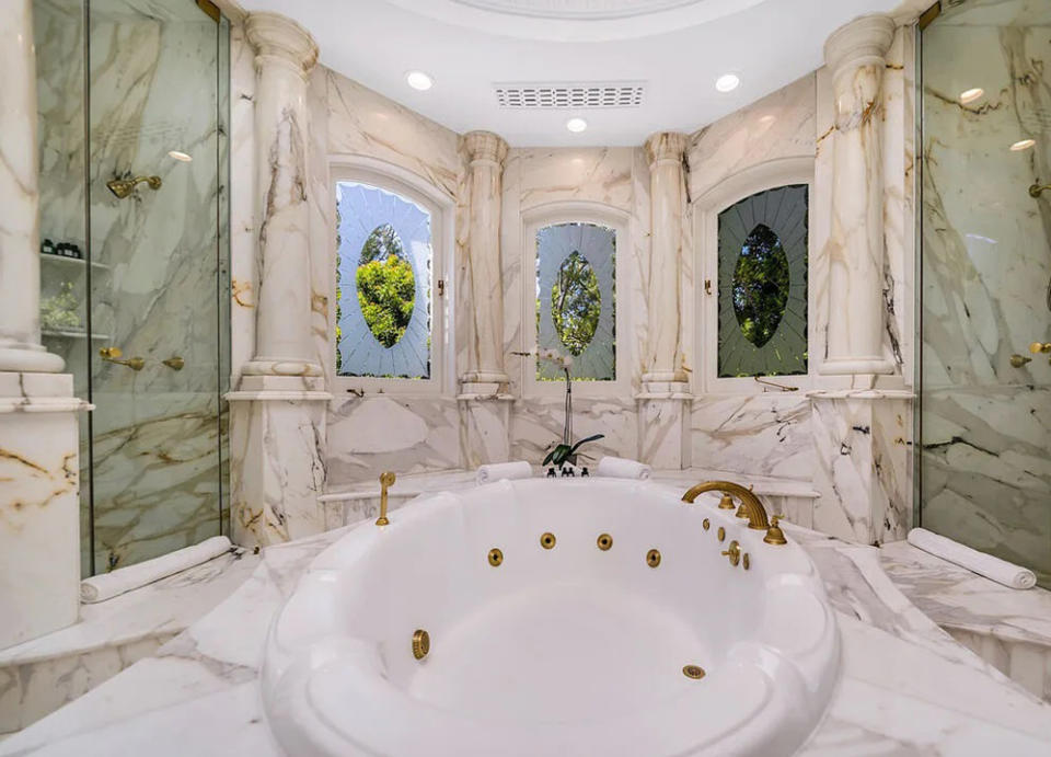 A look inside the opulent marble-clad primary bathroom at the Laurella Estate