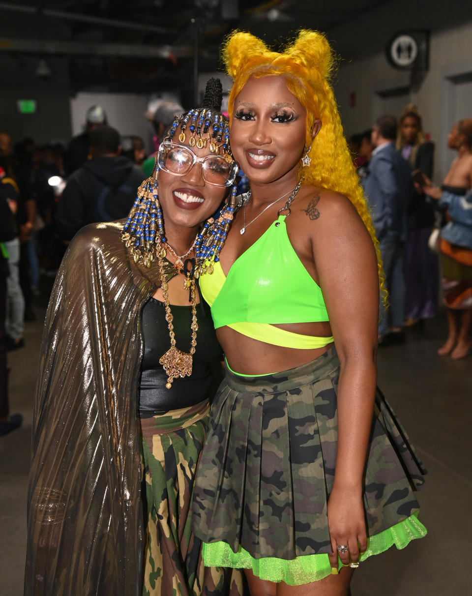 Baby Tate and Dionne smiling and standing together