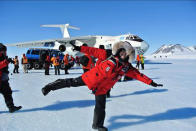 Dr. Diego Delgado does his best airplane pose in front of the Ilyushin.