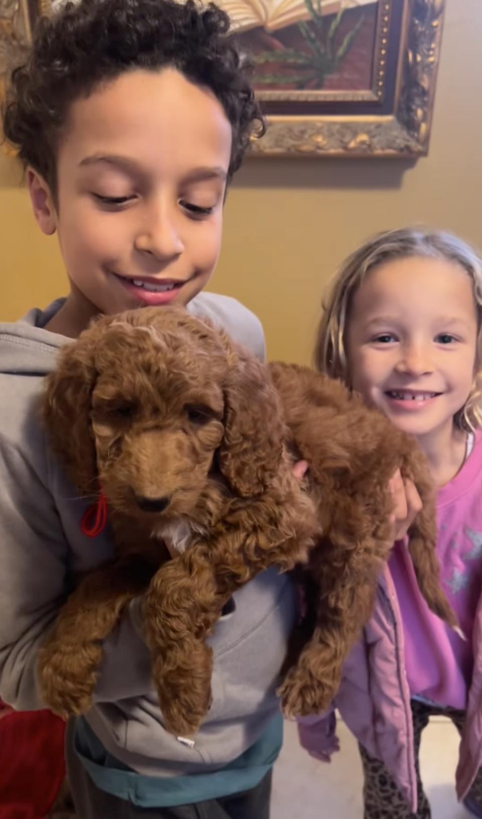 Delano Melvin holds dog Myles