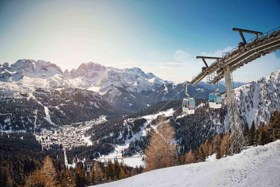 <p>DANIELE MOLINERIS/COURTESY OF APT CAMPIGLIODOLOMITI</p> Cable cars shuttle skiers up the slopes at Madonna di Campiglio.