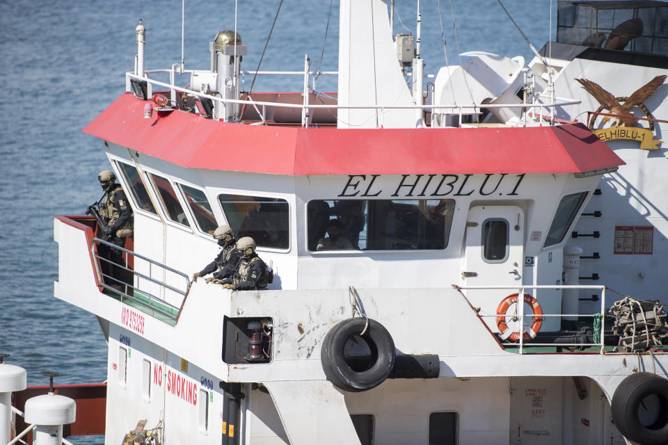 Armed forces stand onboard the Turkish oil tanker El Hiblu 1, which was hijacked by migrants, in Valletta, Malta, Thursday March 28, 2019. A Maltese special operations team on Thursday boarded a tanker that had been hijacked by migrants rescued at sea, and returned control to the captain, before escorting it to a Maltese port. (AP Photo/Rene' Rossignaud)