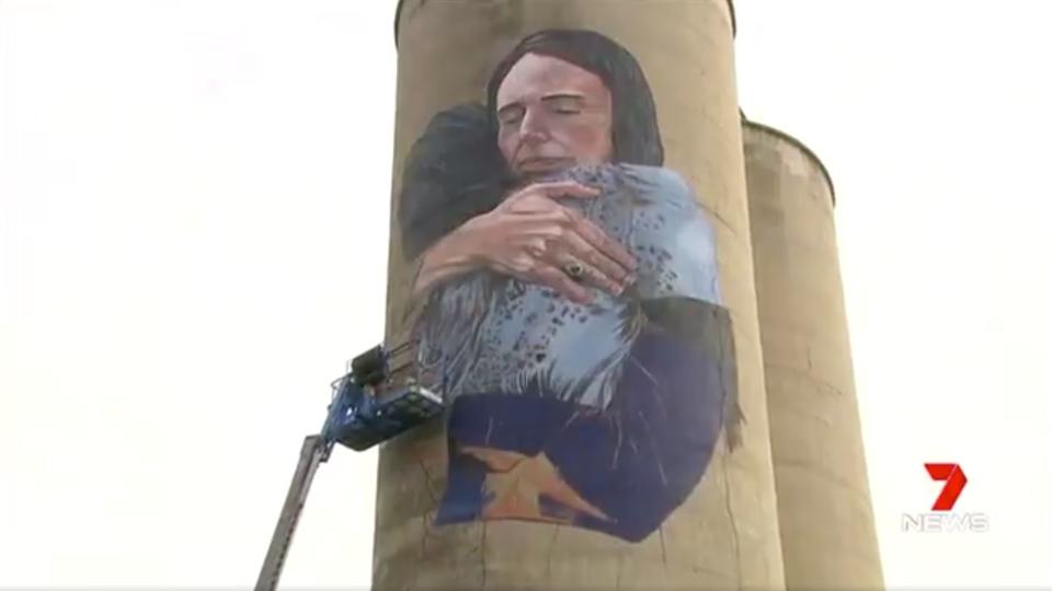 A mural of New Zealand Prime Minister Jacinda Ardern hugging a Muslim woman in Christchurch is nearing completion on the Tinning Street silos in Melbourne.