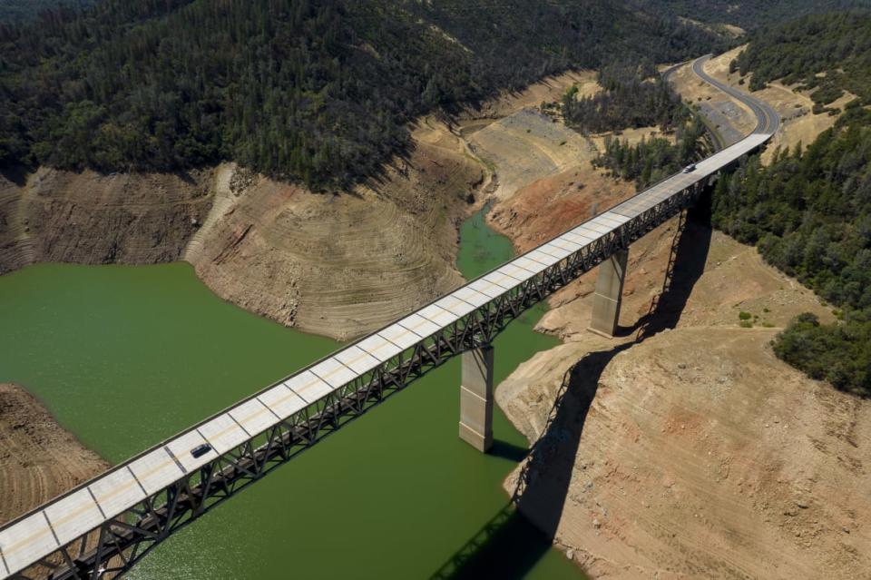 <div class="inline-image__title">1233610710</div> <div class="inline-image__caption"><p>A car travels across Enterprise Bridge above Oroville Lake during low water levels in Oroville, California, U.S., on Tuesday, June 22, 2021. </p></div> <div class="inline-image__credit">Bloomberg/Getty</div>