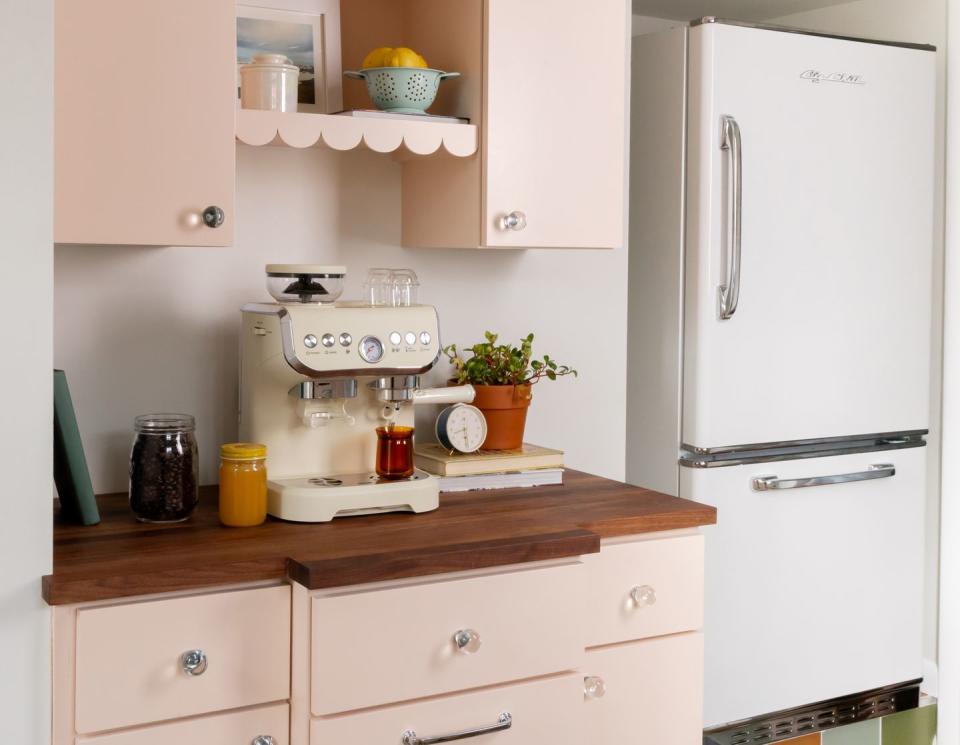 retro style kitchen with blush pink cabinets