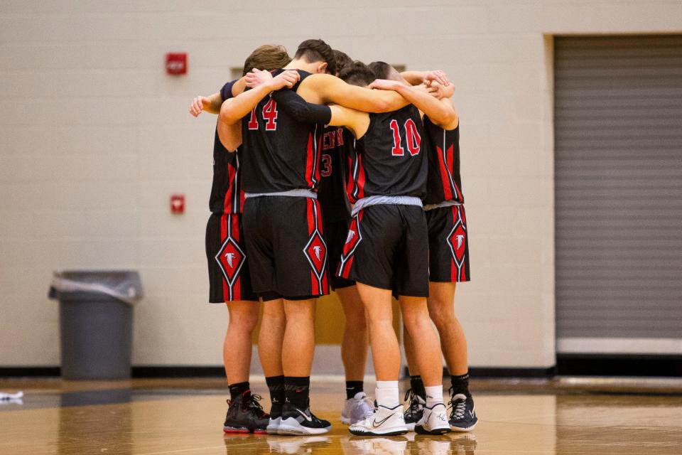 John Glenn players circle up before the Saint Joseph vs. John Glenn boys basketball game Friday, Jan. 14, 2022 at Saint Joseph High School in South Bend. 