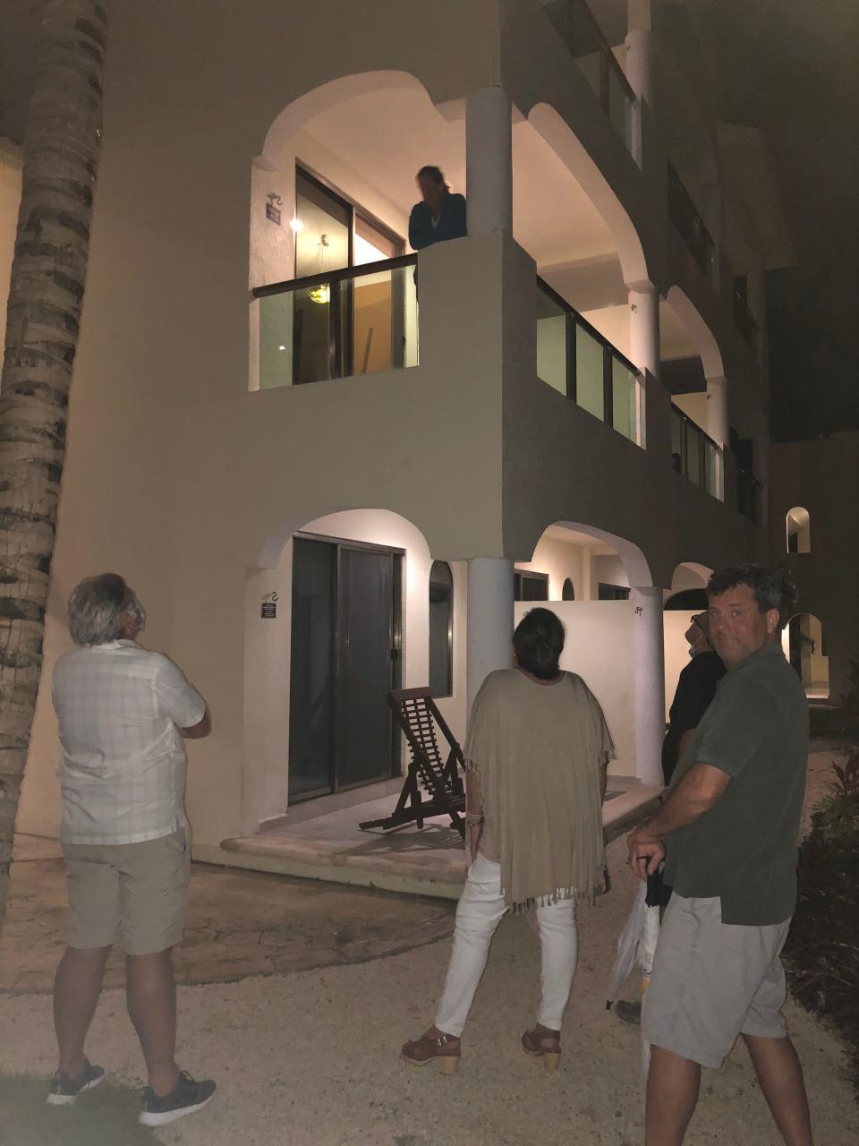 Lucia Rooney talks to friends and family members from her balcony during COVID isolation at El Dorado Casitas Royale resort in Riviera Maya, Mexico.