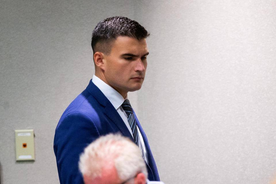 New administrative aide Jordan Epperson walks to his seat in the conference room Tuesday, Sept. 12, 2023.