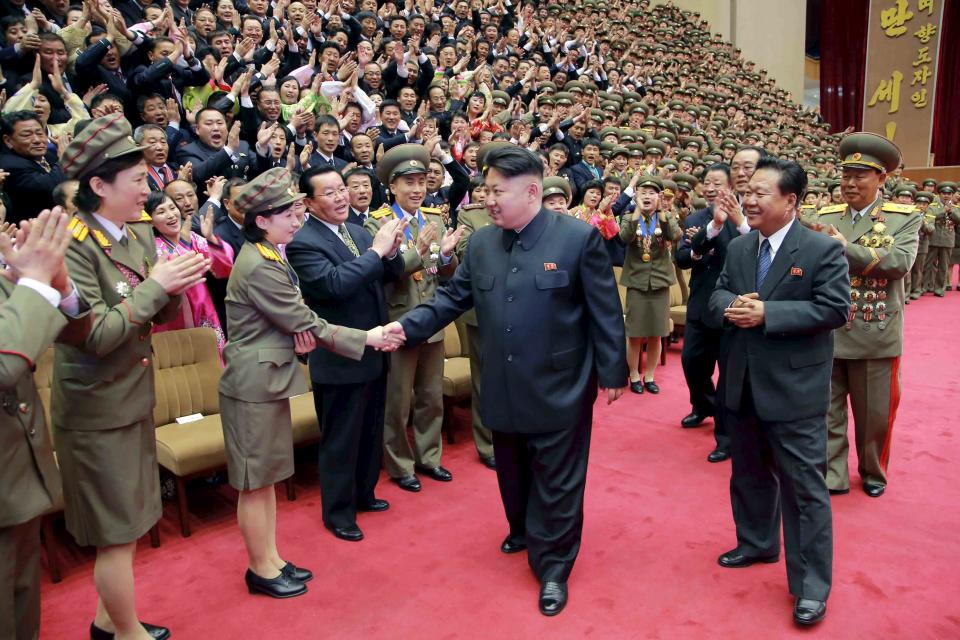 North Korean leader Kim Jong Un shakes hands during a photo session with participants in the 7th National Conference of Sportspersons in this undated photo released by North Korea's Korean Central News Agency (KCNA) in Pyongyang March 27, 2015. REUTERS/KCNA ATTENTION EDITORS - THIS PICTURE WAS PROVIDED BY A THIRD PARTY. REUTERS IS UNABLE TO INDEPENDENTLY VERIFY THE AUTHENTICITY, CONTENT, LOCATION OR DATE OF THIS IMAGE. FOR EDITORIAL USE ONLY. NOT FOR SALE FOR MARKETING OR ADVERTISING CAMPAIGNS. THIS PICTURE IS DISTRIBUTED EXACTLY AS RECEIVED BY REUTERS, AS A SERVICE TO CLIENTS. NO THIRD PARTY SALES. SOUTH KOREA OUT. NO COMMERCIAL OR EDITORIAL SALES IN SOUTH KOREA.