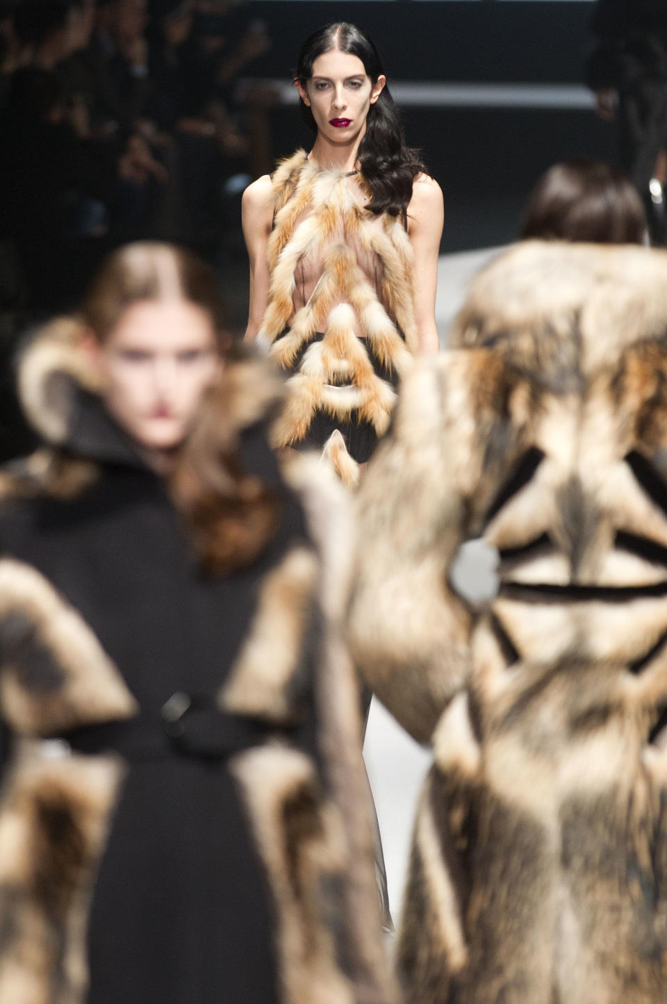 Models wear creations from designers Viktor & Rolf  as part of the Fall-Winter, ready-to-wear 2013 fashion collection, during Paris Fashion week, Saturday, March 3, 2012. (AP Photo/Jacques Brinon)