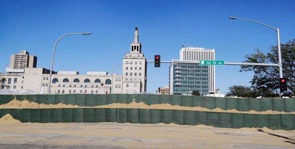 <p>A flood wall made of Hesco barriers line the banks of the Cedar River, Monday, Sept. 26, 2016, in Cedar Rapids, Iowa. (AP Photo/Charlie Neibergall)</p>