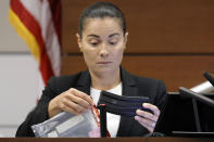 Broward Sheriff's Office Sgt. Gloria Crespo testifies about the weapon used by Marjory Stoneman Douglas High School shooter Nikolas Cruz in the 2018 shootings that has a swastika etched on the gun's magazine. This during the penalty phase of Cruz's trial at the Broward County Courthouse in Fort Lauderdale, Fla. on Tuesday, Sept. 27, 2022. Sgt. Crespo took the photograph (for evidence purposes) of the gun used by Cruz after the shootings. Cruz previously plead guilty to all 17 counts of premeditated murder and 17 counts of attempted murder in the 2018 shootings. (Amy Beth Bennett/South Florida Sun Sentinel via AP, Pool)